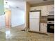 Modern kitchen featuring granite counters and white appliances at 9218 40Th N Way, Pinellas Park, FL 33782