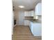 Bright kitchen with white cabinets, granite countertops, and updated appliances at 9218 40Th N Way, Pinellas Park, FL 33782