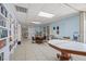 Cozy library with floor-to-ceiling bookshelves and comfortable seating at 9218 40Th N Way, Pinellas Park, FL 33782