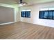 A well-lit living room with wood floors and multiple large windows for natural light at 9218 40Th N Way, Pinellas Park, FL 33782