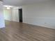 Open-concept living room with light wood flooring and classic trim details at 9218 40Th N Way, Pinellas Park, FL 33782