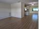 Open floor plan with wood-look flooring and lots of natural light at 9218 40Th N Way, Pinellas Park, FL 33782