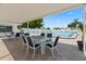 Enjoy poolside dining and lounging at this beautiful covered patio near a pool at 9218 40Th N Way, Pinellas Park, FL 33782