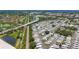Aerial view of the mobile home community with a lush landscape, a highway, and nearby ponds and golf course at 9790 66Th N St # 353, Pinellas Park, FL 33782
