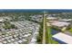 Aerial view of the mobile home community near Tampa, Florida, with a railway and cityscape visible at 9790 66Th N St # 353, Pinellas Park, FL 33782