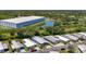 Scenic aerial view highlighting well-maintained mobile homes, a serene pond, and a large commercial building in a lush setting at 9790 66Th N St # 353, Pinellas Park, FL 33782
