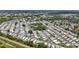 Aerial view of the mobile home community exhibiting a close-knit design with mature trees and manicured streets at 9790 66Th N St # 353, Pinellas Park, FL 33782