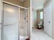 Bathroom featuring walk-in shower with sliding door, and connecting toilet room at 9790 66Th N St # 353, Pinellas Park, FL 33782