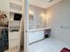 Bathroom featuring single sink vanity, lots of storage, and neutral walls and floors at 9790 66Th N St # 353, Pinellas Park, FL 33782
