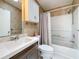 A well-lit bathroom featuring a single sink vanity, toilet, and shower-tub combination at 9790 66Th N St # 353, Pinellas Park, FL 33782