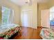 A bedroom featuring twin beds, a large window, and a closet providing ample storage space at 9790 66Th N St # 353, Pinellas Park, FL 33782