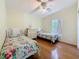 Bedroom featuring two twin beds, light-colored floors, and a ceiling fan with lighting at 9790 66Th N St # 353, Pinellas Park, FL 33782
