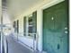 Accessible front entrance features a ramp, dark green door, and complementary window shutters at 9790 66Th N St # 353, Pinellas Park, FL 33782