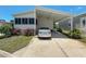 Charming single-story home featuring a carport, and a well-manicured lawn at 9790 66Th N St # 353, Pinellas Park, FL 33782