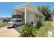 Well-maintained home exterior with a carport and landscaped front yard at 9790 66Th N St # 353, Pinellas Park, FL 33782