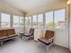 A bright Florida room with multiple windows providing natural light and views of the surrounding area at 9790 66Th N St # 353, Pinellas Park, FL 33782