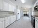 Bright kitchen with stainless steel appliances and an opening to an outdoor screened in porch at 9790 66Th N St # 353, Pinellas Park, FL 33782