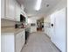 Bright kitchen features stainless steel appliances, light countertops, and a large tiled floor at 9790 66Th N St # 353, Pinellas Park, FL 33782