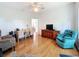 This large living room has hardwood floors, views from the windows, and comfortable seating at 9790 66Th N St # 353, Pinellas Park, FL 33782