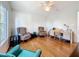 Living room featuring hardwood floors, nice views from the windows, a ceiling fan, and lots of natural light at 9790 66Th N St # 353, Pinellas Park, FL 33782