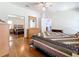 Comfortable bedroom with wood floors, mirrored closet doors and light wood dresser at 9790 66Th N St # 353, Pinellas Park, FL 33782