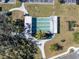 Aerial view of shuffleboard courts surrounded by trees, providing a relaxing community activity at 9790 66Th N St # 353, Pinellas Park, FL 33782