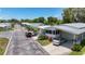 Charming mobile home community with well-maintained homes, carports, and lush landscaping, offering a serene neighborhood setting at 9790 66Th N St # 353, Pinellas Park, FL 33782
