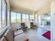 Inviting sunroom filled with natural light and offering a seamless transition to the indoors at 9790 66Th N St # 353, Pinellas Park, FL 33782