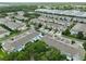 Attractive aerial shot of a residential community featuring neat rows of houses and mature trees throughout the neighborhood at 10132 Post Harvest Dr, Riverview, FL 33578