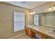 Bathroom with double sinks, and a tub shower with tile surround at 10132 Post Harvest Dr, Riverview, FL 33578