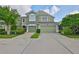 Exterior shot of two story home with a two car garage at 10132 Post Harvest Dr, Riverview, FL 33578
