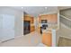 Bright kitchen with wood cabinets, black appliances, and tiled floor at 10132 Post Harvest Dr, Riverview, FL 33578