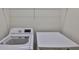 Laundry room with LG front load washer and dryer with wire shelf storage at 10132 Post Harvest Dr, Riverview, FL 33578