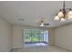 Spacious living room with ceiling fan and sliding doors leading to the lanai at 10132 Post Harvest Dr, Riverview, FL 33578