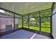 Enclosed patio offering views of a lush, green lawn at 10132 Post Harvest Dr, Riverview, FL 33578