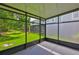 Screened patio with view of green lawn and shade trees at 10132 Post Harvest Dr, Riverview, FL 33578