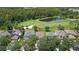 Aerial view of the house near a lush golf course and pond at 10559 Coral Key Ave, Tampa, FL 33647