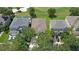 An aerial view of a well-manicured home next to a golf course and perfectly manicured lawn at 10559 Coral Key Ave, Tampa, FL 33647