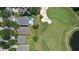 Overhead view of backyard with a patio and view of the golf course; well-maintained landscaping adds to the property's appeal at 10559 Coral Key Ave, Tampa, FL 33647