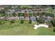 Aerial view of the house in a residential neighborhood with golf course access at 10559 Coral Key Ave, Tampa, FL 33647