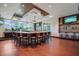 A well-lit community bar area with an extensive counter and multiple televisions at 10559 Coral Key Ave, Tampa, FL 33647