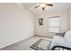 Simple bedroom featuring a futon and carpeted floors providing a flexible space for guests or relaxation at 10559 Coral Key Ave, Tampa, FL 33647