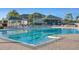 Large community pool with lap lanes, clear blue water, and ample deck space for relaxation and sunbathing at 10559 Coral Key Ave, Tampa, FL 33647