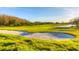 Picturesque golf course featuring bright green fairways, pristine sand traps, and clear blue skies, offering a golfer's paradise at 10559 Coral Key Ave, Tampa, FL 33647