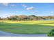 Picturesque golf course view with manicured greens, mature trees and a distant lake creating a serene golfing experience at 10559 Coral Key Ave, Tampa, FL 33647