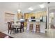 Eat in kitchen with wood cabinets, granite countertops, tile floors and stainless appliances at 10559 Coral Key Ave, Tampa, FL 33647
