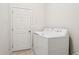 Functional laundry room with a washer and dryer, and a white door at 10559 Coral Key Ave, Tampa, FL 33647