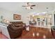 Inviting living room features hardwood floors, comfortable seating, and an open layout to the kitchen area at 10559 Coral Key Ave, Tampa, FL 33647