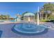 Gathering friendly pool area with splash fountain, playground and waterslide at 10559 Coral Key Ave, Tampa, FL 33647