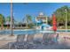 Community pool with a water slide, plenty of lounge chairs, and a relaxing atmosphere at 10559 Coral Key Ave, Tampa, FL 33647